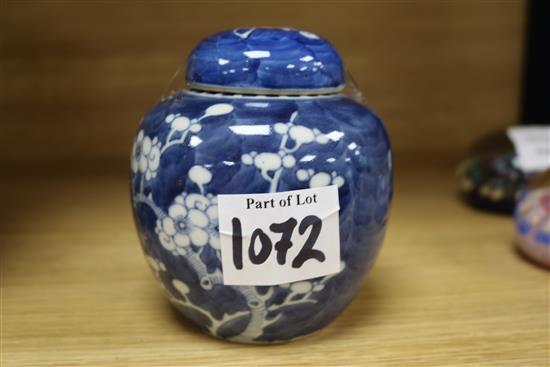A large Chinese prunus jar and cover and another small jar